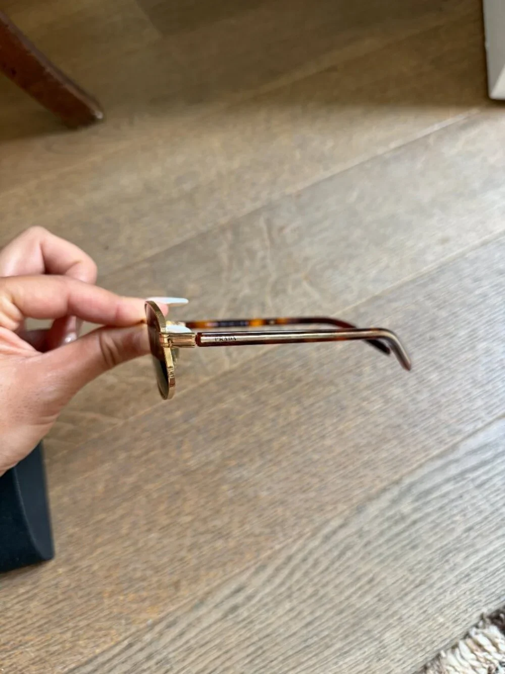 Prada PR oval sunglasses in gold with brown lenses